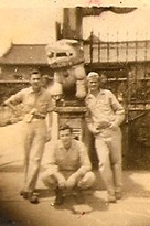 Posing beside a Sculpture